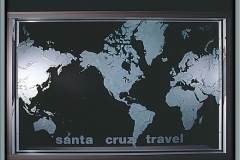 corporate: 48\"x72\" carved glass world map, used as a apartion and lighted at night.