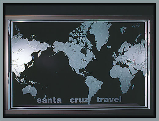 corporate: 48\"x72\" carved glass world map, used as a apartion and lighted at night.